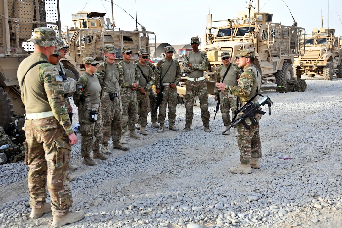 U.S. Army Sgt. 1st Class Jason Alaniz, Right, Gives A Mission Brief To ...