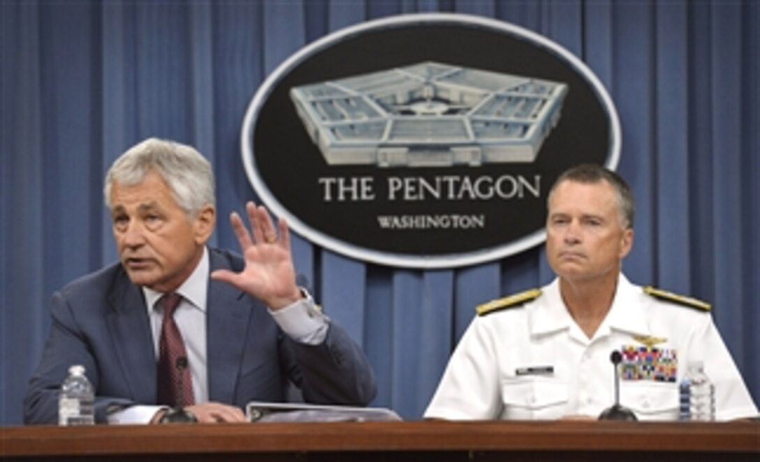 Secretary of Defense Chuck Hagel, left, answers a reporter’s question during a Pentagon press briefing on the recent Strategic Choices Management Review in Arlington, Va., on July 31, 2013.  Vice Chairman of the Joint Chiefs of Staff Adm. James Winnefeld Jr. joined Hagel for the briefing.  The purpose of the review was to understand the impact of further budget reductions on the Department, and develop options to deal with these additional cuts.  