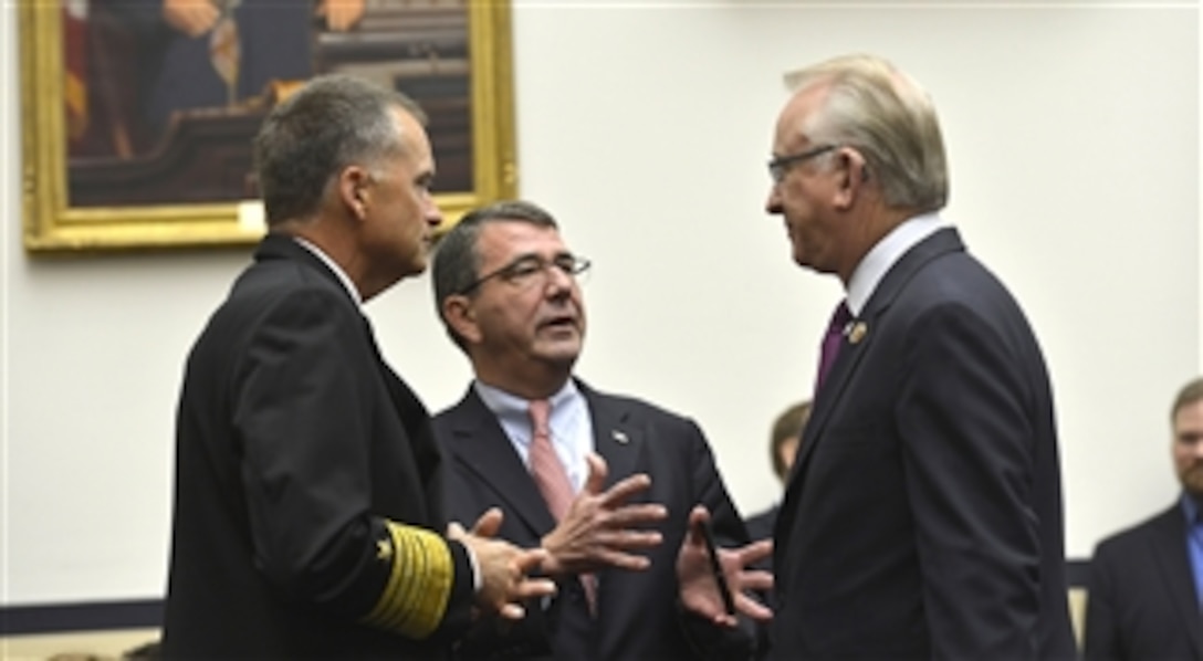 Deputy Secretary of Defense Ashton B. Carter, center, and Vice Chairman of the Joint Chiefs of Staff Adm. James A. Winnefeld, left, speak with House Armed Service Committee Chairman Howard P. "Buck" McKeon shortly before testifying to the committee on the Strategic Choices and Management Review in the Rayburn House Office Building in Washington, D.C., Aug. 1, 2013.   