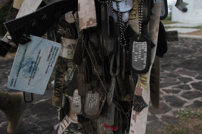 Identification tags, name tapes and more, drape a stand atop Mt. Suribachi on Iwo Jima. The tokens are meant to symbolize the success of those who have traversed the mountain to leave behind something of themselves in remembrance of those who have fallen on the shores of the island during the invasion landing in 1945.