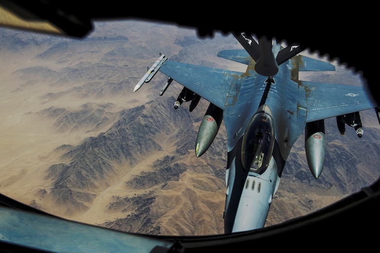 An F-16 Fighting Falcon receives fuel during an in-air refueling mission July 17, 2013, over Afghanistan.  The fuel was provided by a KC-135 Stratotanker from the 340th Expeditionary Air Refueling Squadron. (U.S. Air Force photo/Staff Sgt. Marleah Miller)