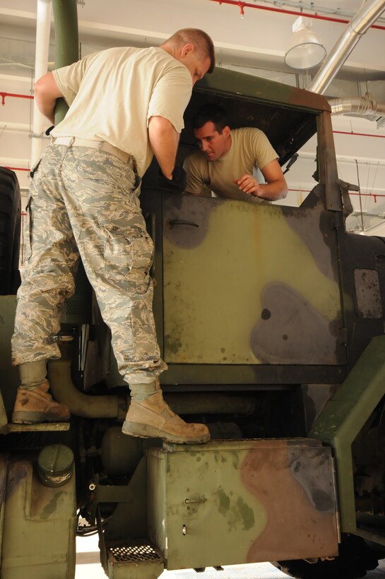 Airmen from the 200th RED HORSE Squadron Ohio Air National Guard, restore an M-900 Series Wrecker August 2, 2013, on Andersen Air Force Base, Guam. One of the unit’s primary responsibilities while here on a temporary duty assignment was to provide Andersen with vehicle maintenance. (U.S. Air Force photo by Airman 1st Class Amanda Morris/Released)