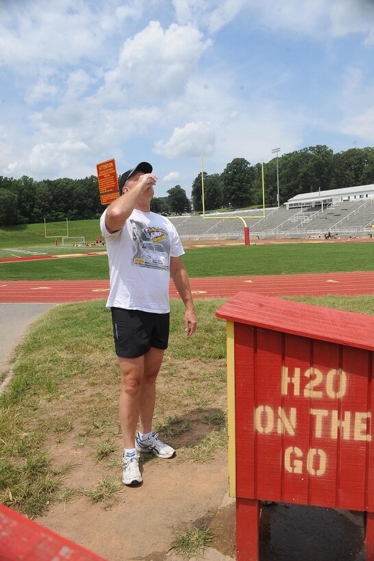 Marchar Bison, 53, uses the H20 water station after a long run at Butler Stadium aboard Marine Corps Base Quantico on July 30, 2013. The water station provides Marines and civilians a good source of hydration while conducting physical training.