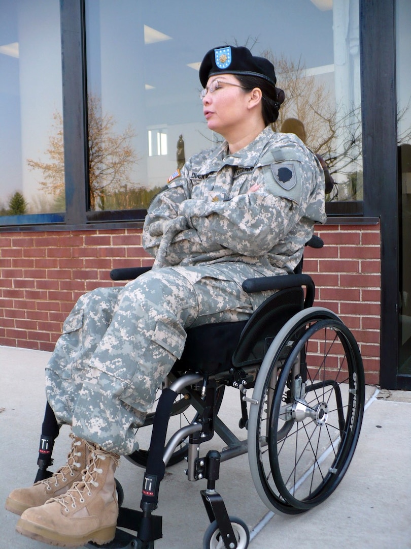Maj. Tammy Duckworth talks to a reporter following a recent family academy in Springfield. Duckworth, former director of the Illinois Department of Veterans' Affairs, said Vietnam veterans taught America a lot of lessons. She said "It doesn't matter where you stand on war, you must love the warrior." Illinois National Guard Family Academies were implemented in 2008 to prepare Soldiers' loved ones for their return and give families the tools and insight to ease the challenges of reintegration.