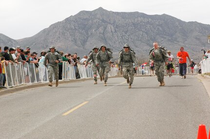 Team Juggernaut, made up of five Soldiers from Green Bay-based Co., B, 2-127th Infantry crossed the finish line in first place in the National Guard Heavy category of the 2009 Bataan Memorial Death March at White Sands Missile Range in Las Cruces, N.M., on March 29, 2009. The team included: Spc. Andrew Vannieuwehoven, Green Bay; Pfc. Jesse Tlachac, Sturgeon Bay; Sgt. Ryan Gries, Madison; Pfc. Eric Sallenbach, Green Bay; and Pfc. Kyle Cooper, Appleton.