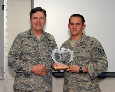 Staff Sgt. Zachary E. Swain, a tactical air control party craftsman from the 238th Air Support Operations Squadron in Meridian, Miss., received an award for being the 1,000th graduate of The I.G. Brown Air National Guard Training and Education Center's Instructional Development branch. Swain was presented the award by Col Richard B. Howard, commander of the TEC, when he graduated from the instructor certification program course during a ceremony held at Morrissey Hall here, April 3.