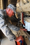 Air Force Staff Sgt. Jason Stephens of the West Virginia Air National Guard performs an inspection on the current generators being used at Joint Task Force Guantanamo's Camp Justice, March 25, 2009. The 474th ECES is here in support of the sustainment of Camp Justice and the Expeditionary Legal Complex.