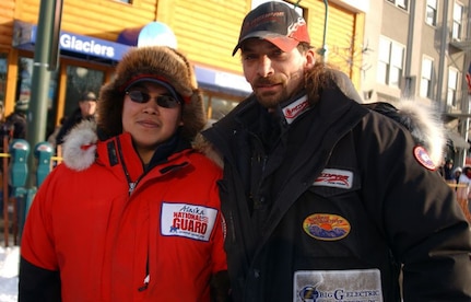 Lance Mackey, right, three-time Iditarod champion, stands with Staff Sgt. Harry Alexie of the Alaska Army National Guard, at the start of the 2009 Iditarod Trail Sled Dog Race. Alexie, a 2009 Iditarod rookie, trained with the veteran musher for months leading up to the race at Mackey's comeback kennel outside of Fairbanks.