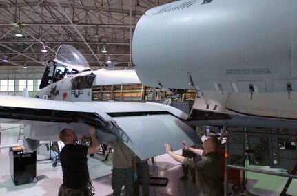 Maintenance Technicians of the 175th Maintenance Group, Maryland National Guard, and 107th Maintenance Group, Michigan National Guard, install a wing flap on an A-10 Thunderbolt close-air-support aircraft at Warfield Air National Guard Base in Essex, Maryland, Friday, April 3, 2009. Michigan Guardmembers in the maintenance field are transitioning from the F-16 fighter jet to the A-10 through on-the-job training.