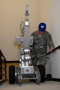 Tech. Sgt. Michael Harvey, 115th Security Forces Squadron, provides cordon security around Bldg. 500 following a report of a suspicious package during an exercise here March 18. The joint exercise included many different units on Truax Field as well as the U.S. Postal Service, Federal Bureau of Investigation and the 54th Civil Support Team.