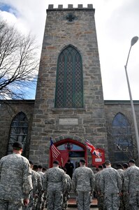 Soldiers from the Massachusetts National Guard, bow their heads in prayer given by Rev. Paul Bresnahan April 4 at the St. Peter's Episcopal Church in Salem, Mass., in remembrance of Capt. Stephen Abbott, founder and first commander of the 2nd Corps of Cadets. This ceremony was part of the 372nd anniversary of the first Salem Muster.