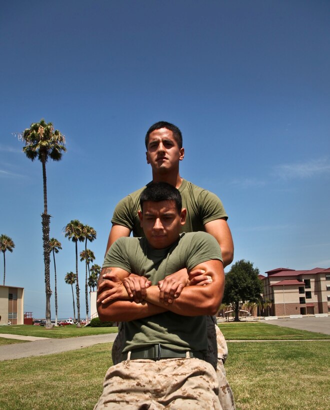 Pfc. Diego Retamozo conducts a buddy drag with Lance Cpl. Albert Perez III, both administration specialists, Command Element, 15th Marine Expeditionary Unit, during combat oriented physical training aboard Camp Pendleton, Calif., Aug. 1. The Marines are preparing for the Combat Fitness Test, an annual physical fitness test that challenges Marines’ physical and mental readiness for the rigors of today’s combat operations. Retamozo, 20, is from Perth Amboy, N.J. and Perez, 21, is from Los Angeles. (U.S. Marine Corps Photo by Cpl. Emmanuel Ramos/Released)
