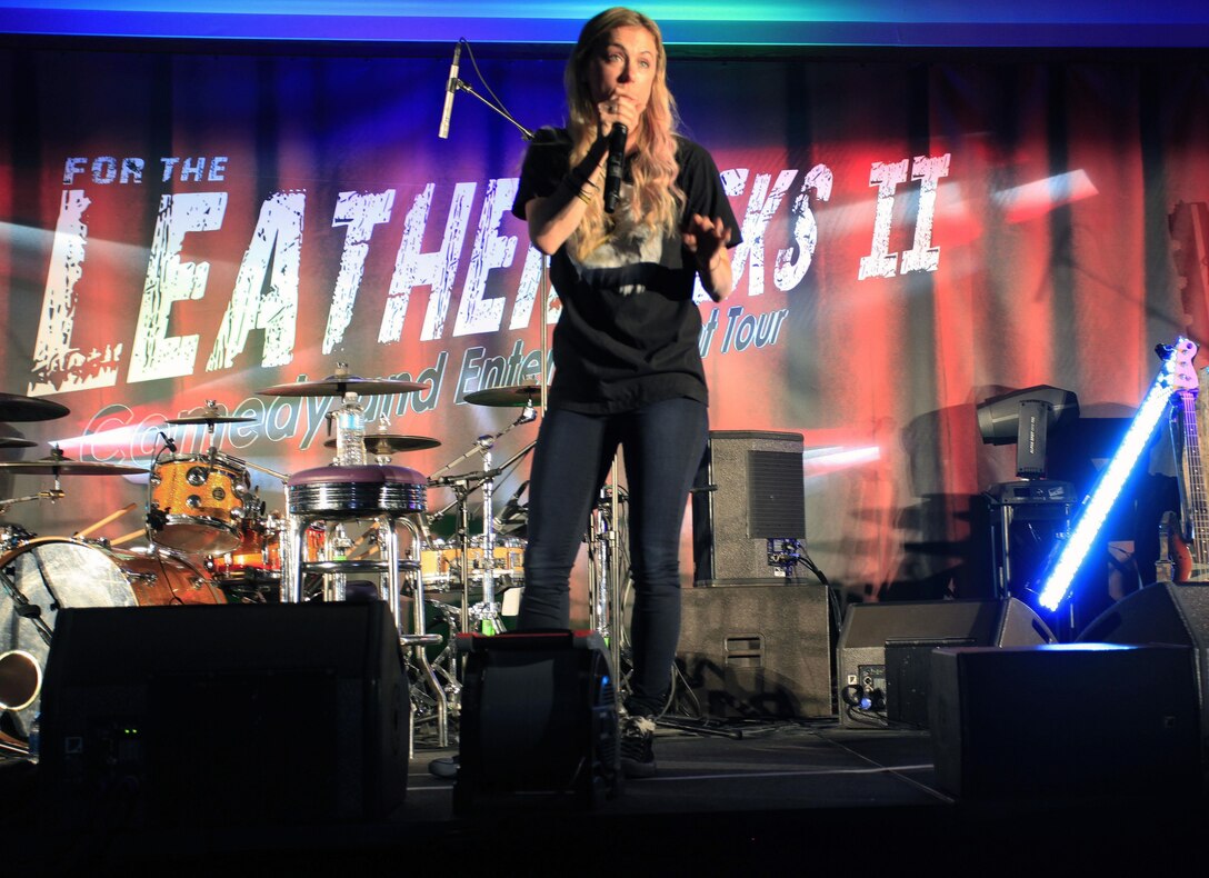 Iliza Schlesinger, a stand-up comic and native of Los Angeles, Calif., performs her routine as part of the Leathernecks Comedy and Entertainment Tour stop at Marine Corps Air Station Yuma, Ariz., July 26. Sponsored by the Single Marine Program, the tour is an effort to offer Marines and sailors at installations some relief from the day-to-day grind of the military. 