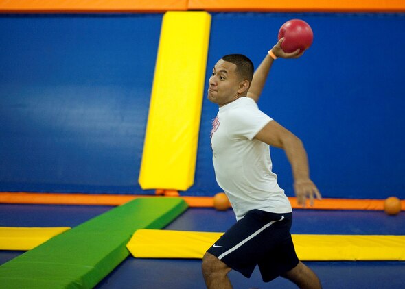 Cpl. Franklin Junay Lemus, administrative specialist, Marine Aircraft Group 24, tries to take out his opponents during a dodgeball game at iTrampoline Hawaii in Kapolei, July 24, 2013. (U.S. Marine Corps photo by Jay Parco)