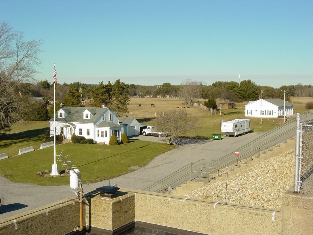 The old operators' quarters at Mansfield Hollow Dam, Mansfield, Conn. Mansfield Hollow Dam lies on the confluence of the Natchaug, Fenton and Mt. Hope Rivers, in Mansfield, Conn. The dam is part of a network of six flood control dams in the Thames River Basin constructed and maintained by the U.S. Army Corps of Engineers. This network helps to reduce flooding in communities within the Thames River Basin by regulating water levels on upstream tributaries in Connecticut and Massachusetts.