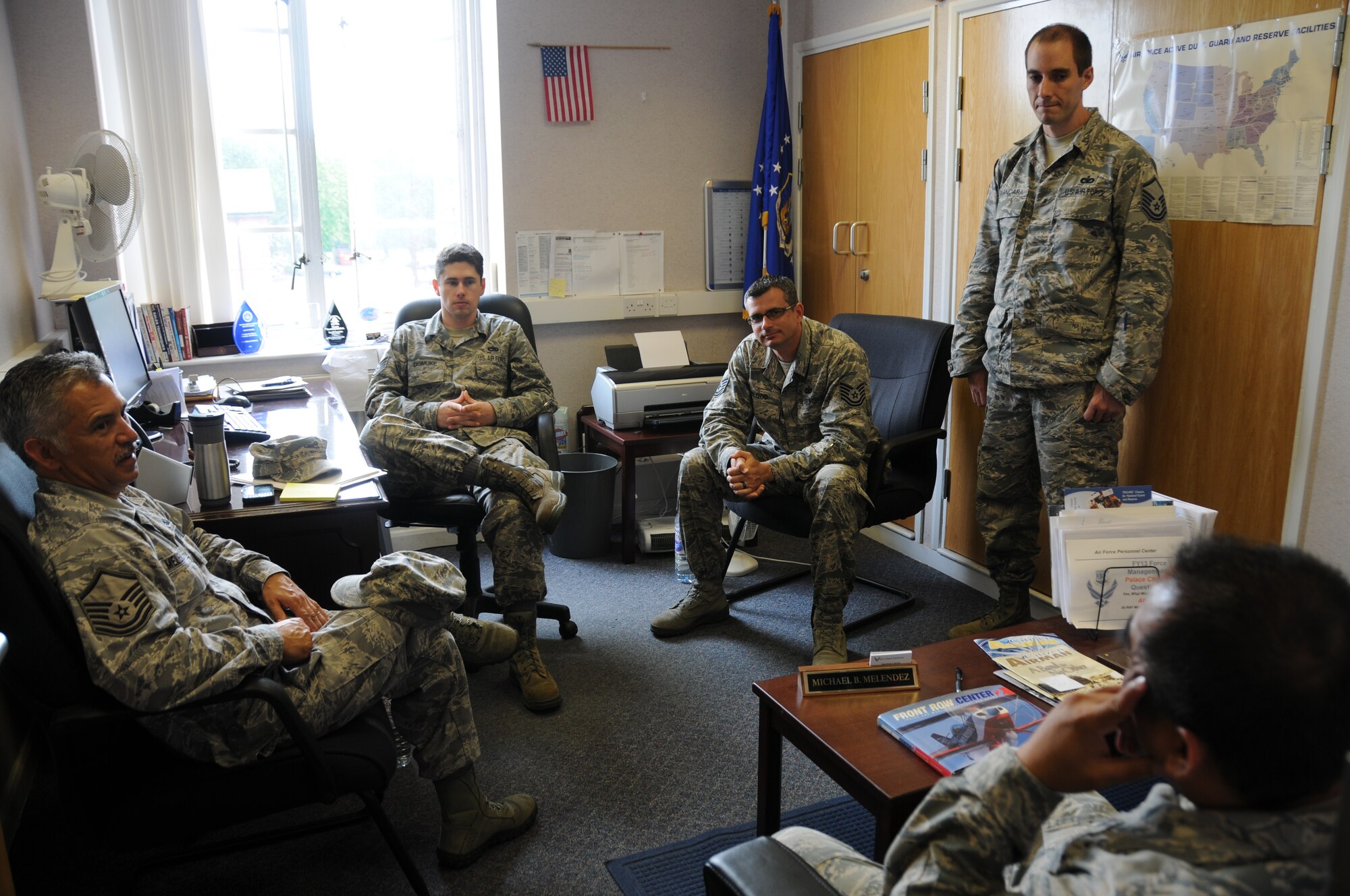 Master Sgt. Michael Melendez, In-Service Recruiter, 100th Air Refueling Wing, RAF Mildenhall, England, along with Tech. Sgts. Donald Blood, Jason Cvancara, and Staff Sgt. Owen Dismuke, all with the 944th FW, Luke Air Force Base, Ariz. speak with an Airmen due to separate soon from active duty about the benefits of joining the Air Force Reserve.  Sgts. Blood, Cvancara, and Dismuke spent their time on annual tour at RAF Mildenhall supporting MSgt. Melendez in his recruiting efforts.  (US Air Force photo by Staff Sgt. Josh Nason)