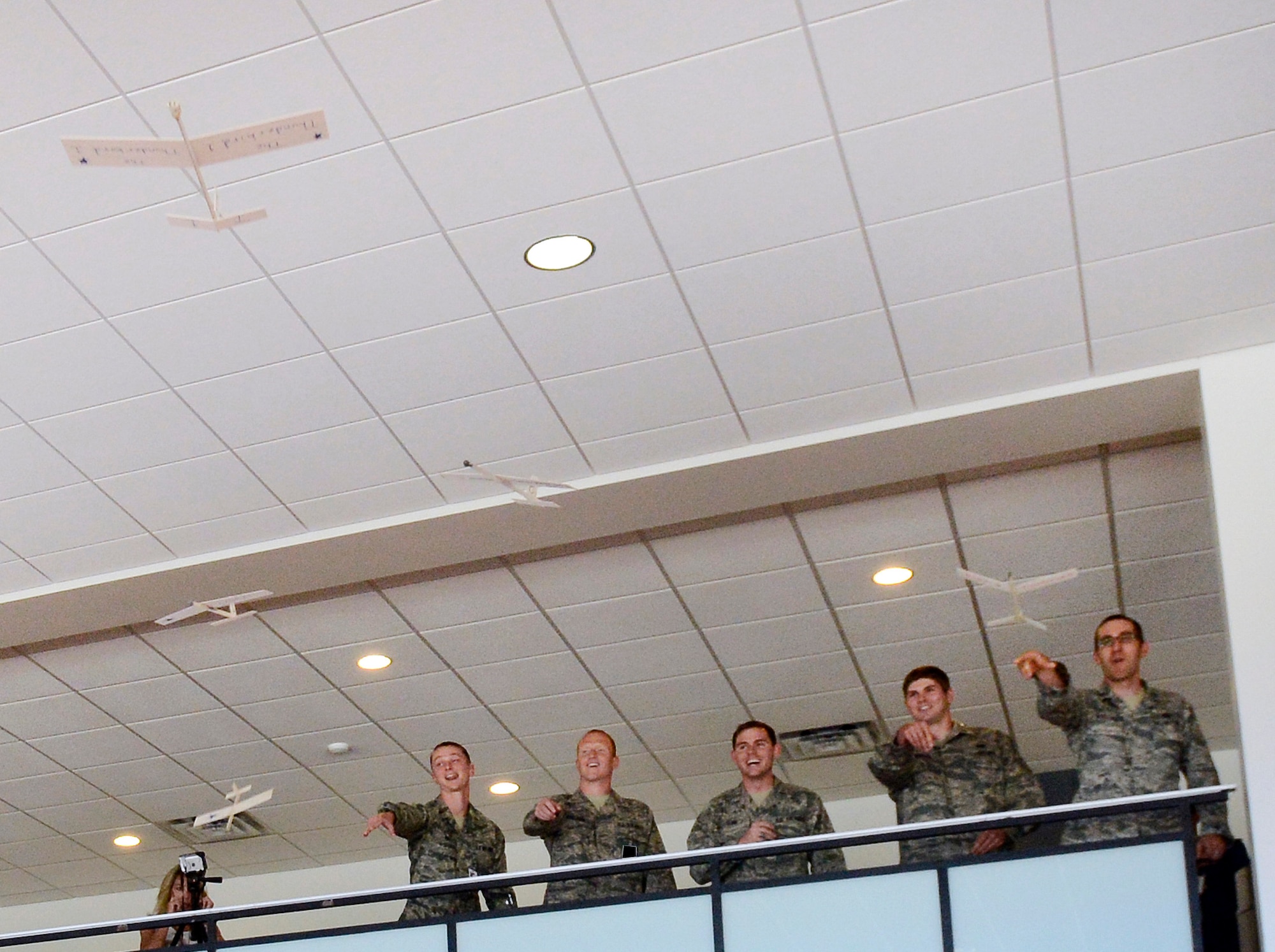 Air Force Academy cadets provide a makeshift flyover for 11 of their fellows who graduated during a ceremony at the Academy Aug. 2, 2013. The final Class of 2013 graduation ceremony increases the total class size to 1,035. (U.S. Air Force photo/Mike Kaplan)