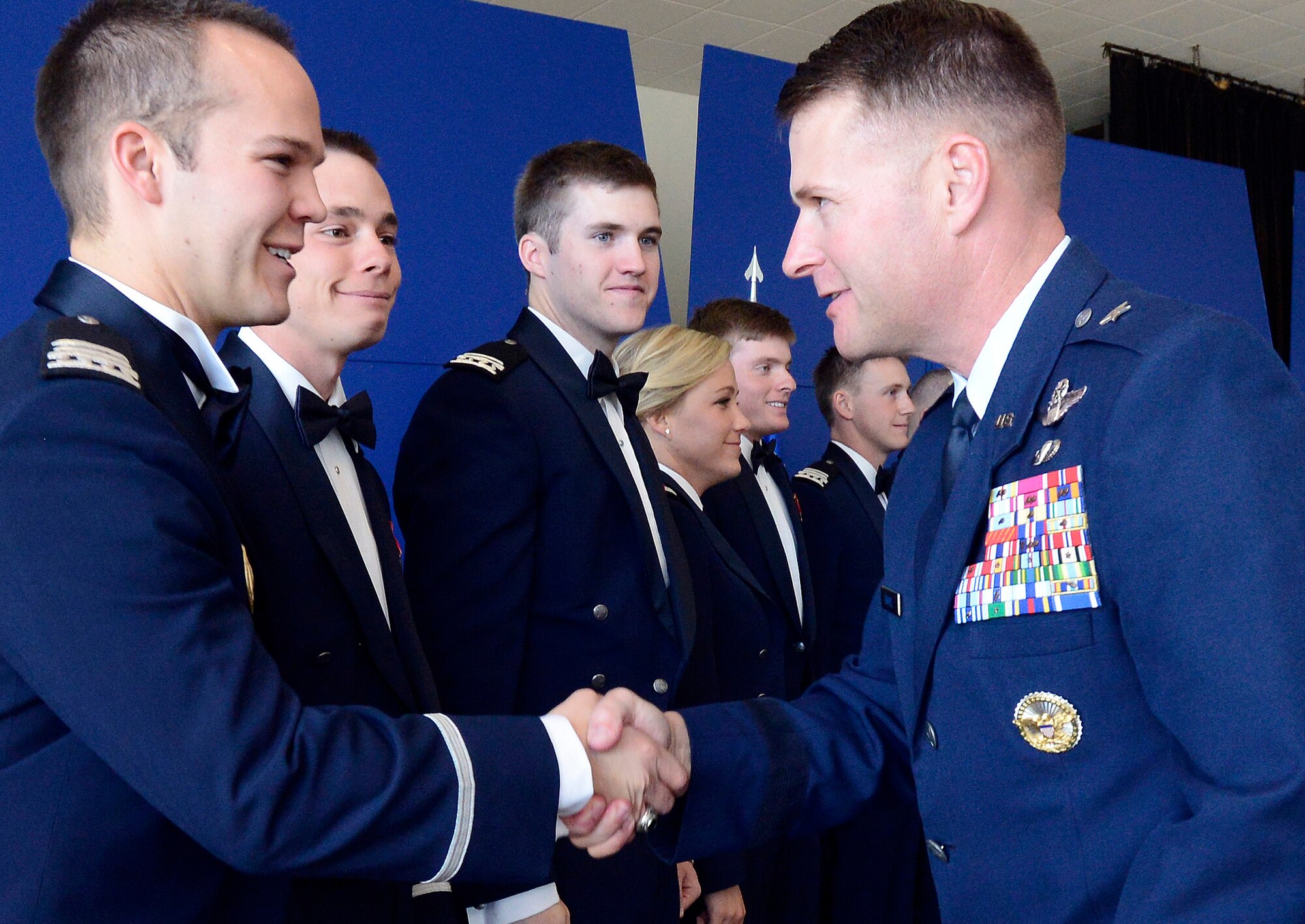 Brig. Gen. Greg Lengyel congratulates Cadet 1st Class Scott Wooden on graduating from the Air Force Academy's Class of 2013 during a ceremony at the Academy Aug. 2, 2013. Wooden, a native of Williamsburg, Va., and 10 others received their diplomas and commissions during the ceremony. Lengyel is the Academy's commandant of cadets. (U.S. Air Force photo/Mike Kaplan)