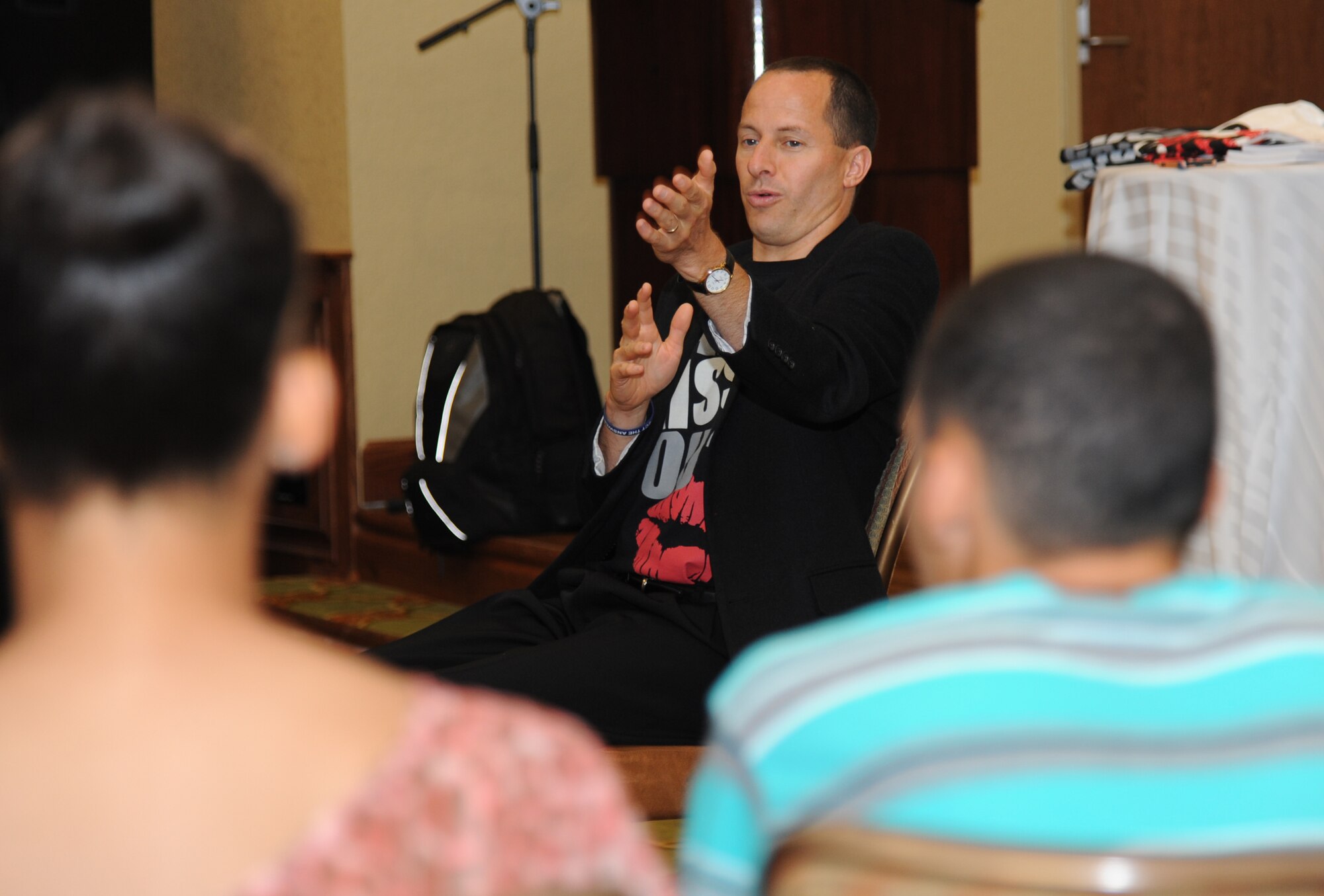 Mike Domitrz, The Safe Date Project, Inc. founder, speaks with Keesler parents and teens about dating and relationships during his “Can I Kiss You” presentation Aug. 1, 2013, at the Bay Breeze Event Center, Keesler Air Force Base, Miss.  The presentation, sponsored by the Keesler Sexual Assault Prevention and Response Office, provides parents, educators, students, military installations, community organizations, and others with resources, educational materials, and programs that address healthy intimacy, sexual assault awareness, and support for sexual assault survivors.  (U.S. Air Force photo by Kemberly Groue)