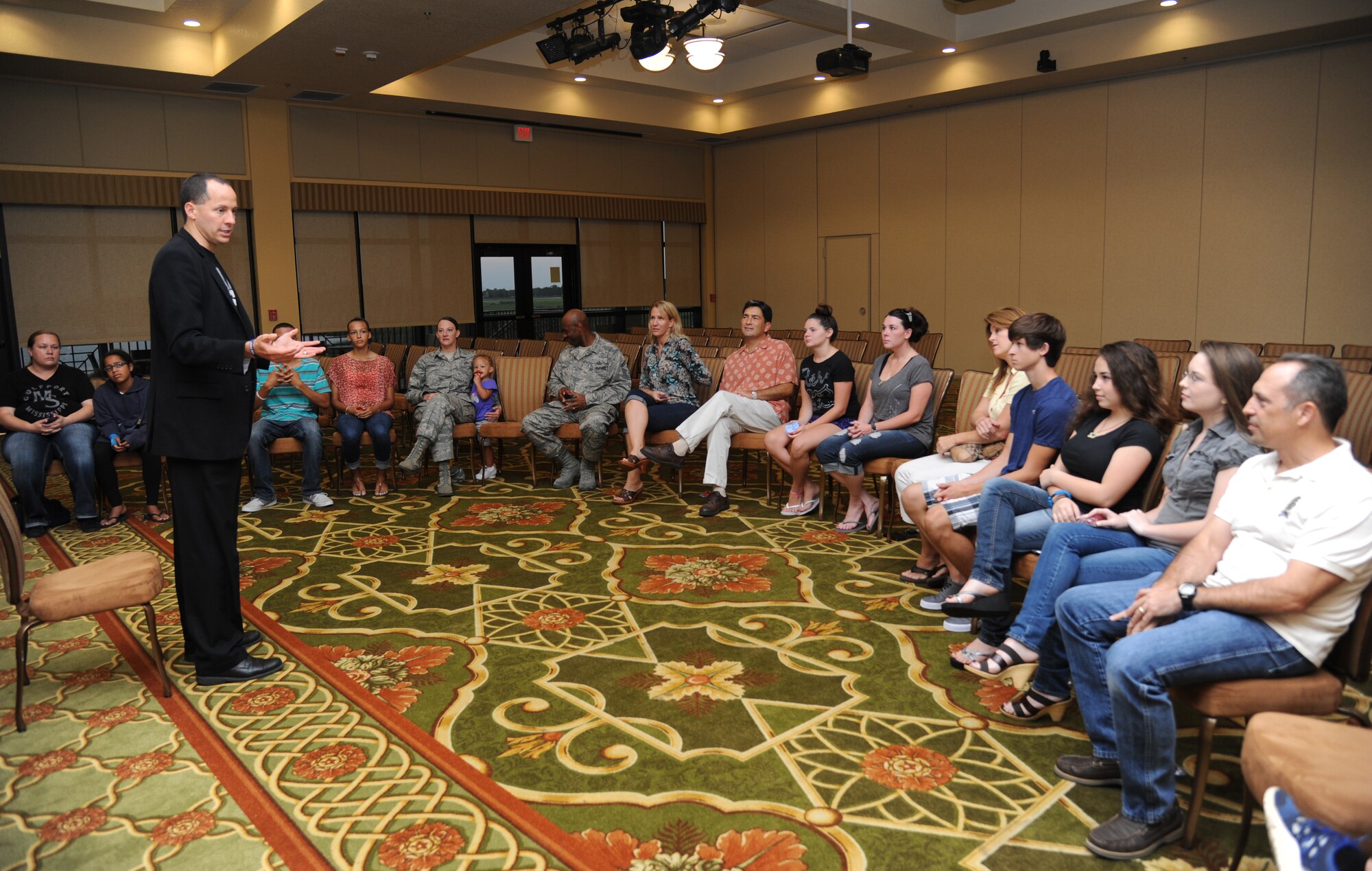 Mike Domitrz, The Safe Date Project, Inc. founder, welcomes Keesler parents and teens to his “Can I Kiss You” presentation Aug. 1, 2013, at the Bay Breeze Event Center, Keesler Air Force Base, Miss.  The presentation, sponsored by the Keesler Sexual Assault Prevention and Response Office, provides parents, educators, students, military installations, community organizations, and others with resources, educational materials, and programs that address healthy intimacy, sexual assault awareness, and support for sexual assault survivors.  (U.S. Air Force photo by Kemberly Groue)