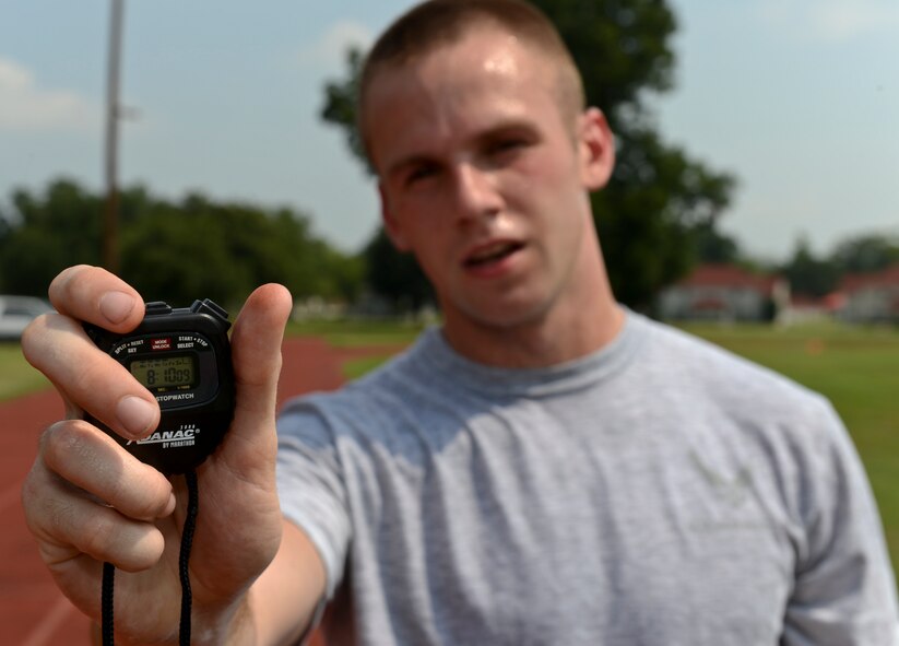 Airman 1st Class Dylan Banks, from the 2nd Maintenance Squadron, holds a stop watch showing his run time on Barksdale Air Force Base, La., Aug. 2, 2013. Banks broke the Barksdale running record for the physical fitness test July 24, 2013. The previous record for the base was 8:19. (U.S. Air Force photo/Senior Airman Micaiah Anthony)
