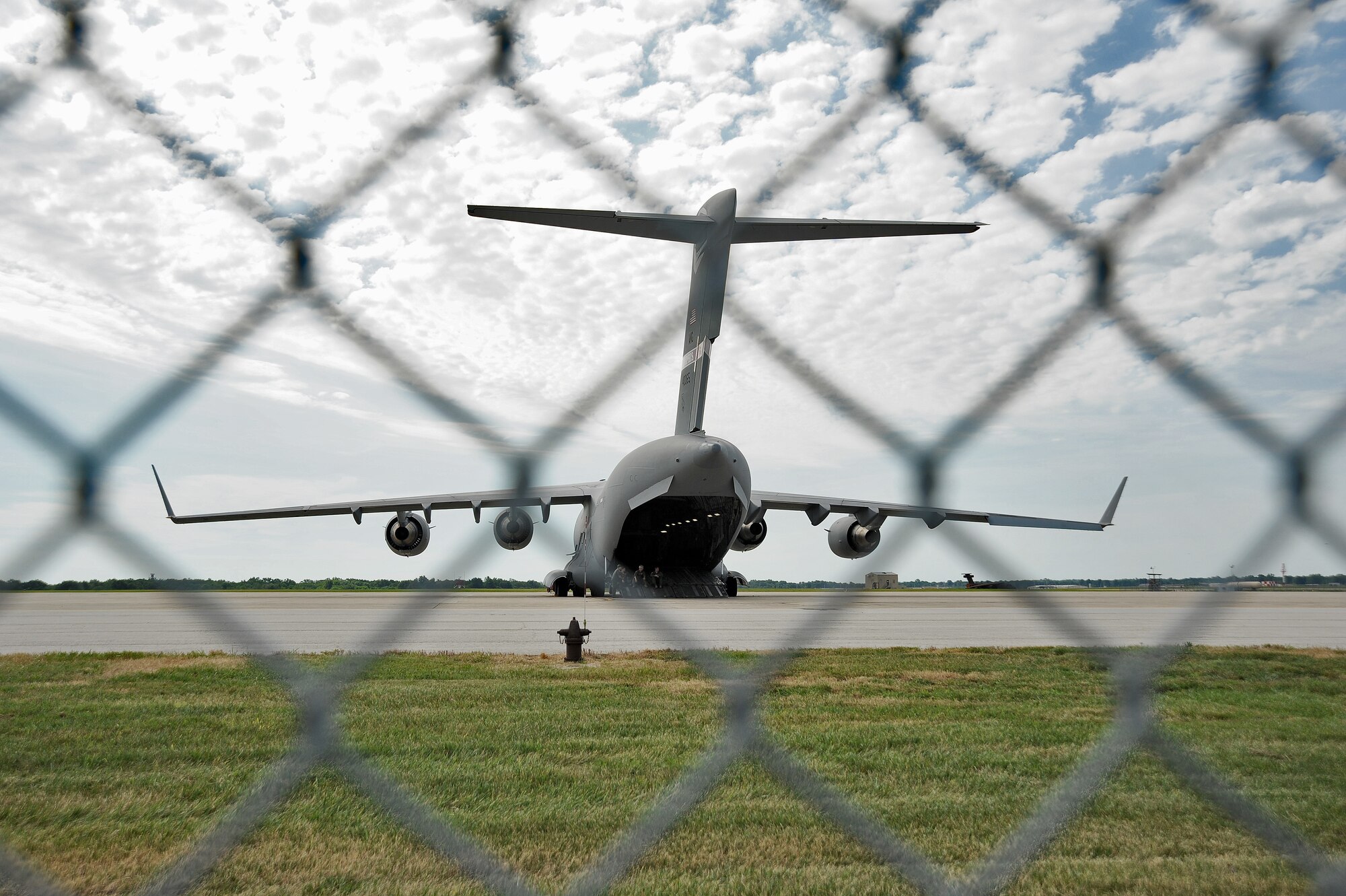 A C-17 Globemaster III from the Memphis Air National Guard’s 164th Airlift Wing, Memphis, Tn., is parked as a transient aircraft at Whiteman Air Force Base, Mo. July 25th, 2013.  The C-17 is capable of rapid strategic delivery of service members and all types of cargo to main operating bases or directly to forward bases in a deployment area. (U.S. Air Force photo by Staff Sgt. Nick Wilson/Released)