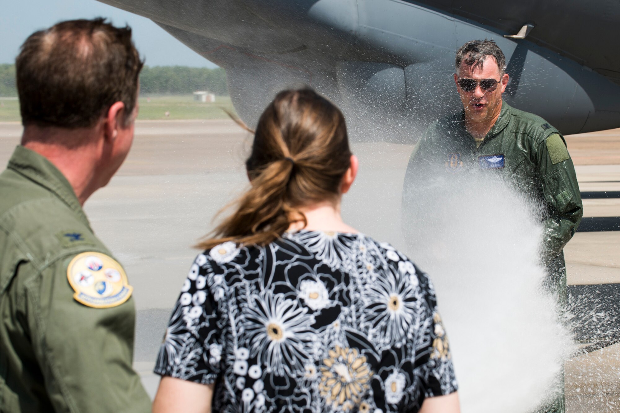 U.S. Air Force Col. Dave Leedom gets  hosed down by his wife, Linda, after his last sortie in a 93rd Bomb Squadron (BS) B-52H Stratofortress, July 31, 2013, Barksdale Air Force Base, La. Leedom is the former commander of the 93 BS and is now the Reserve Advisor to the 8th Air Force Commander. (U.S. Air Force photo by Master Sgt. Greg Steele/Released)