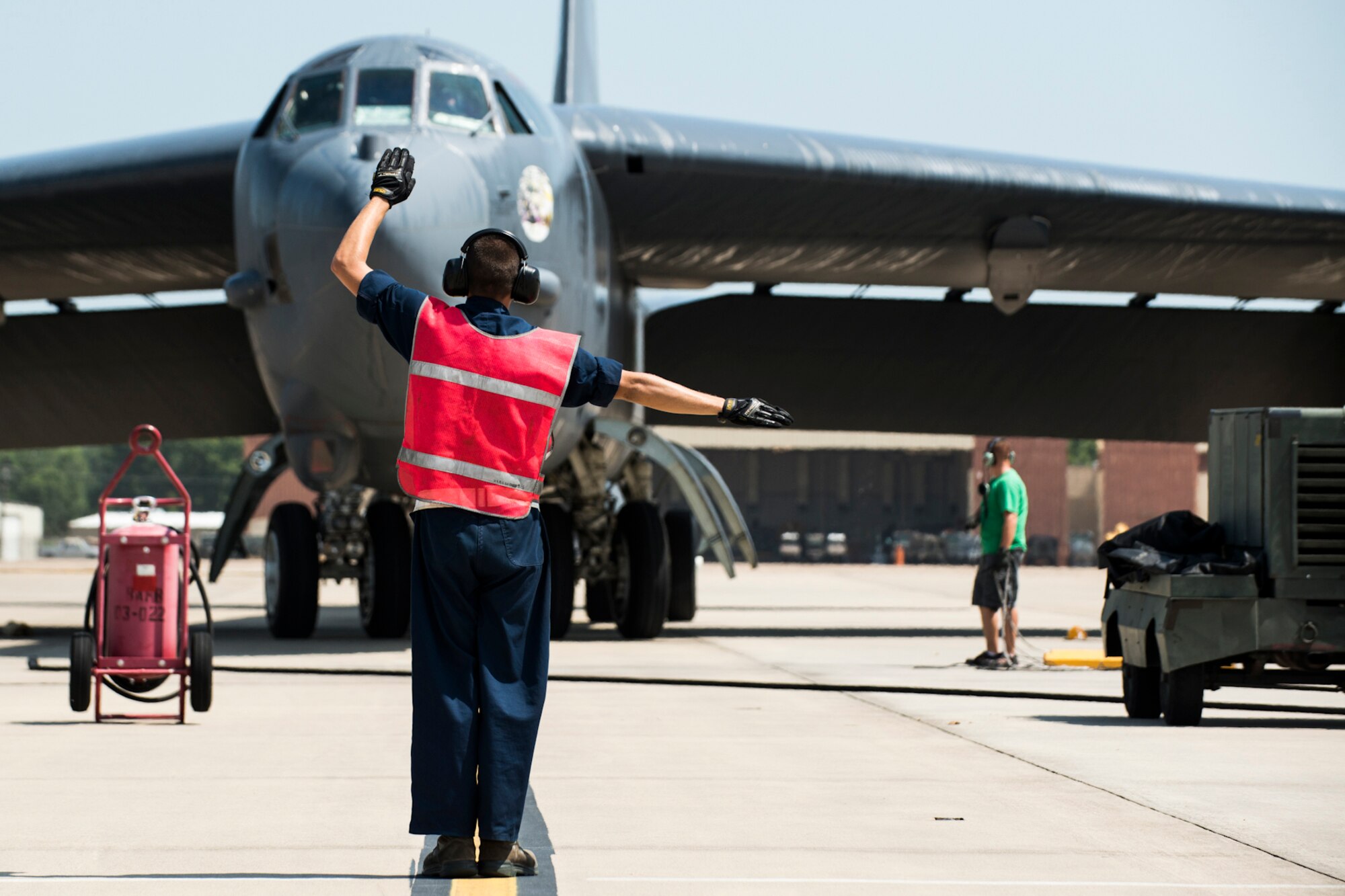 A 93rd Bomb Squadron (BS) B-52H Stratofortress is marshaled to its parking spot after returning from a sortie, July 31, 2013, Barksdale Air Force Base, La. On board the aircraft is U.S. Air Force Col. Dave Leedom, the former commander of the 93rd BS, and this is his last flight in a B-52. (U.S. Air Force photo by Master Sgt. Greg Steele/Released)