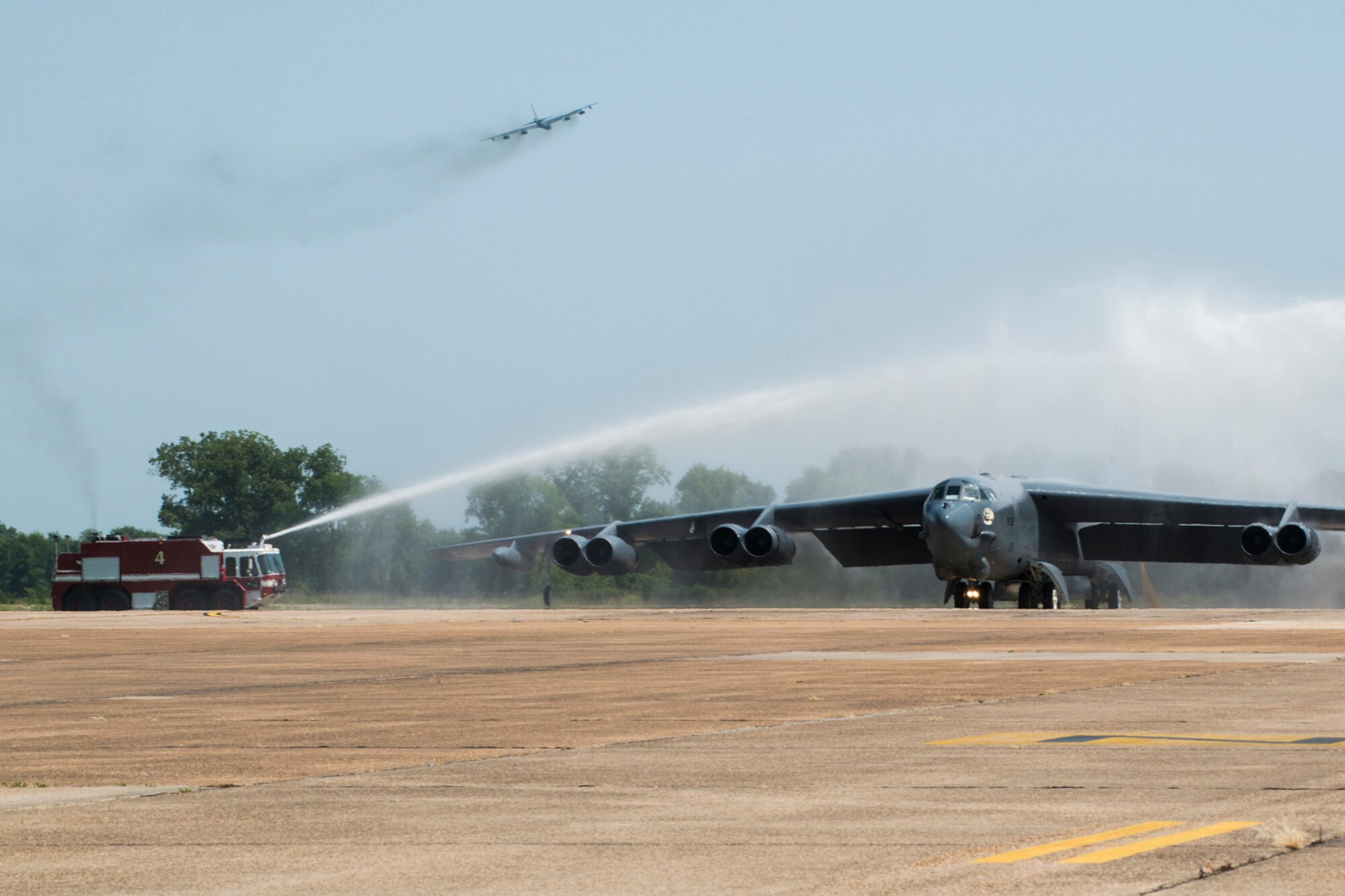 A 93rd Bomb Squadron (BS) B-52H Stratofortress taxis under an arch of water after returning from a sortie, July 31, 2013, Barksdale Air Force Base, La. The sortie commemorated the last flight for Col. Dave Leedom, who is the former commander of the 93 BS. (U.S. Air Force photo by Master Sgt. Greg Steele/Released)