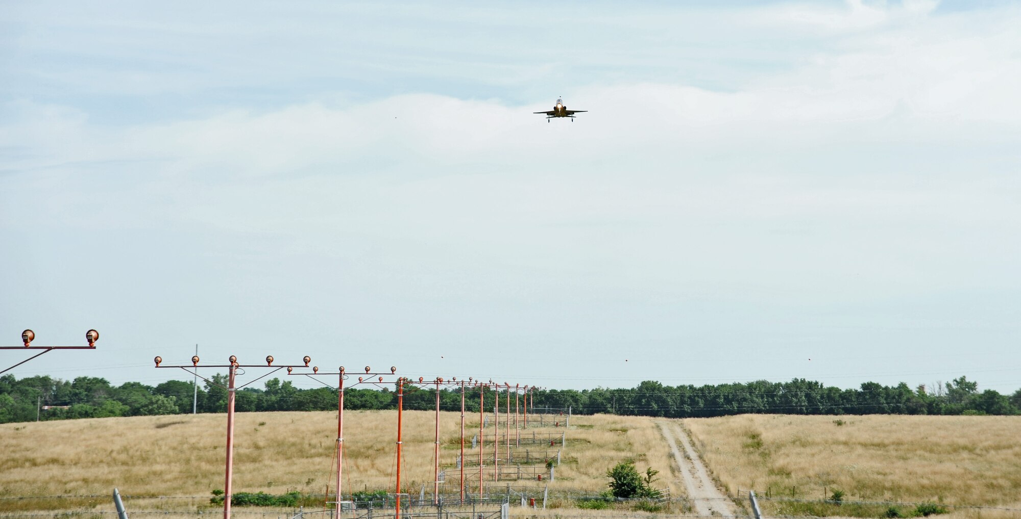 A T-38 Talon from the 509th Bomb Wing prepares to land on the runway during a training sortie at Whiteman Air Force Base, Mo., July 25, 2013. Pilots fly training sorties to stay prepared for any real world mission that may arise. (U.S. Air Force photo by Staff Sgt. Nick Wilson/Released)