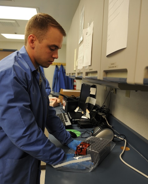 Staff Sgt. David Eley, 2nd Medical Support Squadron laboratory technician, places plasma samples into a biohazard bag on Barksdale Air Force Base, La., Aug. 2, 2013. Samples that cannot be tested by the laboratory are prepared and shipped off to another facility that has the capability to conduct more extensive tests. (U.S. Air Force photo/Senior Airman Benjamin Gonsier)
