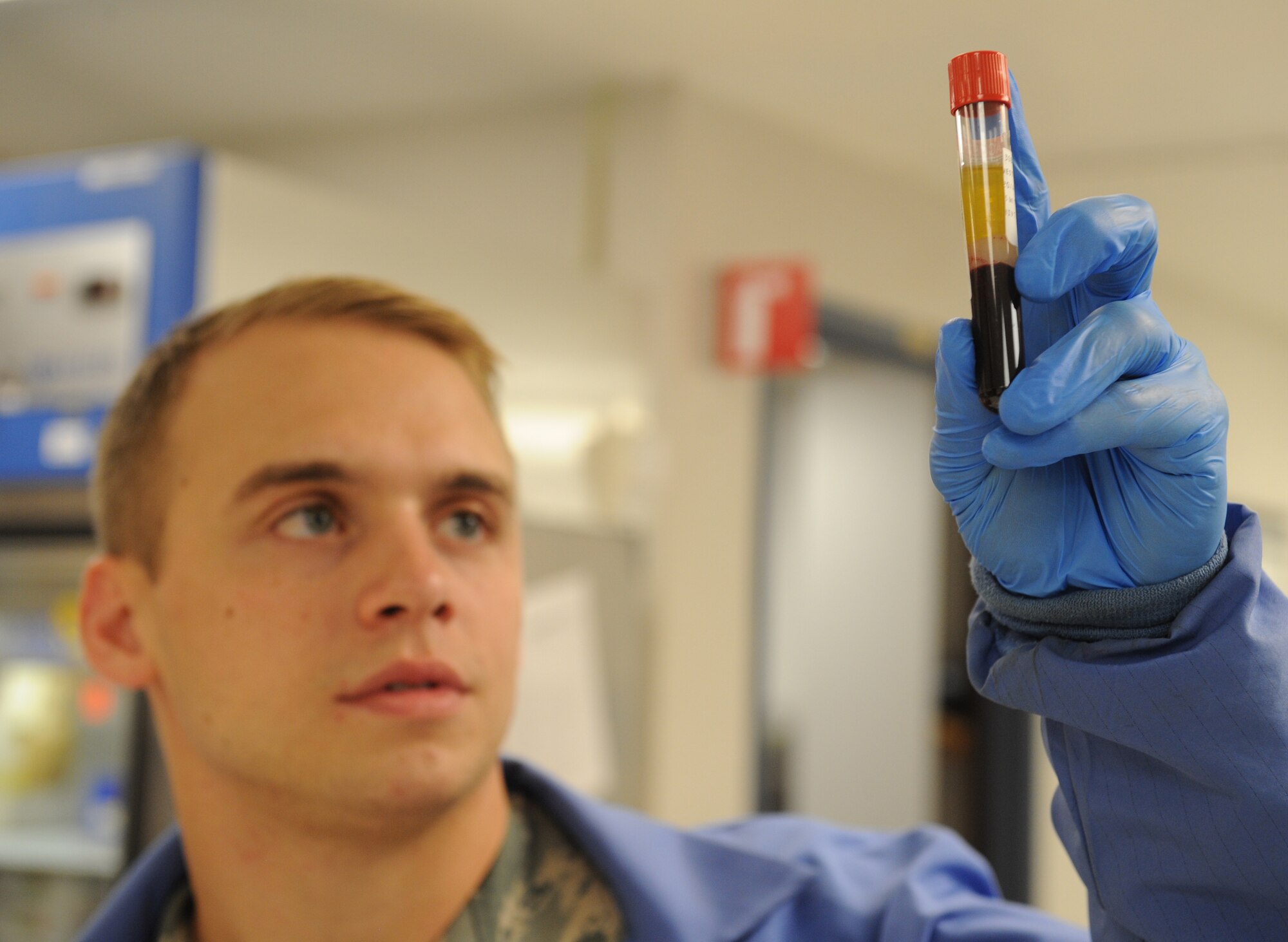 Staff Sgt. David Eley, 2nd Medical Support Squadron laboratory technician, looks at a blood sample on Barksdale Air Force Base, La., Aug. 2, 2013. The 2nd MDSS laboratory technicians conduct numerous tests on blood and urine sample, which help doctors make diagnosis on patients. (U.S. Air Force photo/Senior Airman Benjamin Gonsier)