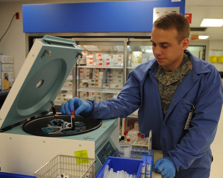 Staff Sgt. David Eley, 2nd Medical Support Squadron laboratory technician, places a blood sample into a centrifuge on Barksdale Air Force Base, La., Aug. 2, 2013. The centrifuge spins at 40,000 revolutions per minute for five minutes. The spinning separates the red blood cells from the plasma, both which are used for different kinds of tests. (U.S. Air Force photo/Senior Airman Benjamin Gonsier)