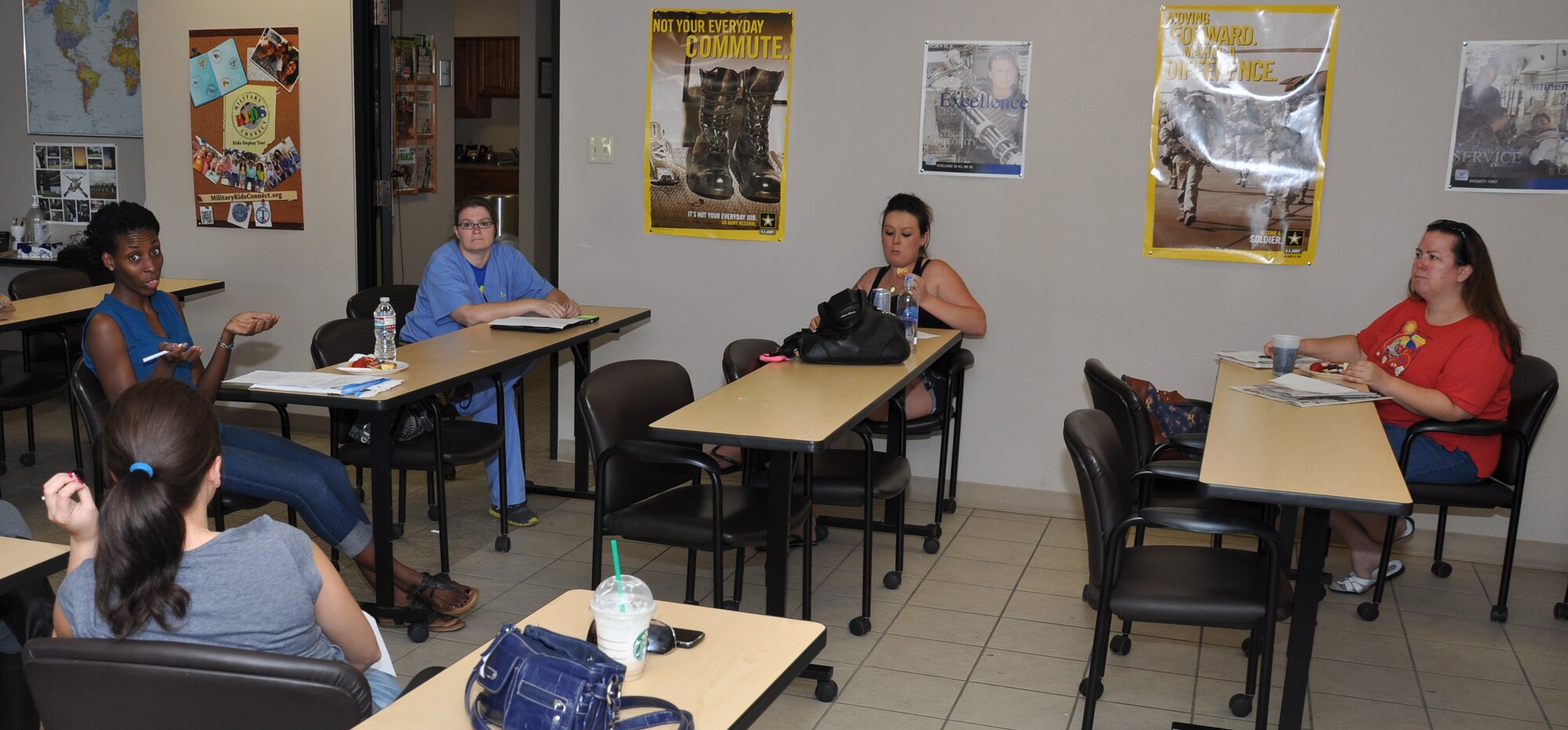Members of the Luke Air Base Enlisted Spouses’ Club discuss items from the agenda July 23 at the 56th Force Support Squadron Airmen and Family Readiness Center. Luke’s ESC is a diverse group of spouses from all walks of life that represent a variety of skills, talents and interests. (U.S. Air Force photo/Staff Sgt. Luther Mitchell)