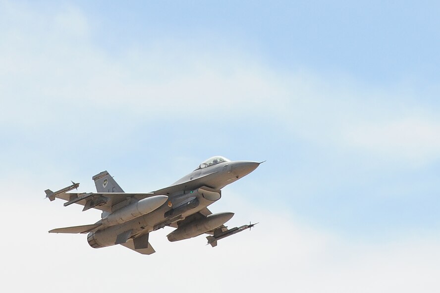 An F-16 Fighting Falcon from the 310th Fighter Squadron takes off during a large force exercise July 19 at Luke Air Force Base. An LFE is the capstone to a pilot’s B-Course that tests the skills learned throughout the course. (U.S. Air Force photo/Airman 1st Class James Hensley)