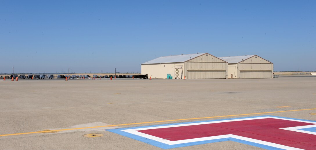 Only two SR-71 Blackbird hangars remain on Beale Air Force Base's flight-line, Aug. 2, 2013. The demolition of the Blackbird hangars is a part of Air Force's "20/20 by 2020" initiative, which aims to reduce excess capacity by reducing a base's footprint, as well as reduce operating costs by 20 percent by the year 2020. (U.S. Air Force photo by Staff Sgt. Robert M. Trujillo/Released)