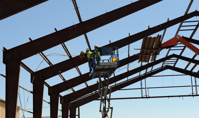 Construction workers cut down the frame of a SR-71 Blackbird hanger at Beale Air Force Base, Calif., July 9, 2013. The Blackbird operated at Beale from 1966 to the late 90s. (U.S. Air Force photo by Staff Sgt. Robert M. Trujillo/Released)