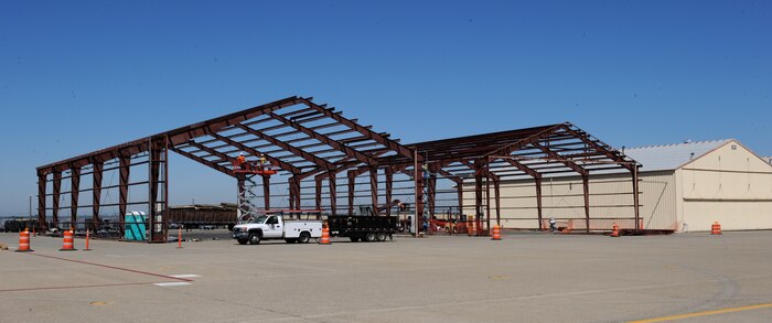 Construction workers demolish two of the SR-71Blackbird hangers at Beale Air Force Base, Calif., July 9, 2013. Only two hangars remain but demolition is pending. (U.S. Air Force photo by Staff Sgt. Robert M. Trujillo/Released)