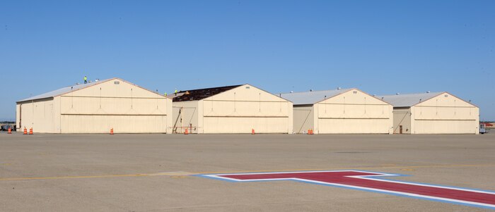 The two of the last four remaining SR-71 Blackbird hangars are taken down piece by piece at Beale Air Force Base, Calif., June 20, 2013. Total deconstruction of the hangers is slated to last three months. (U.S. Air Force photo by Staff Sgt. Robert M. Trujillo/Released) 