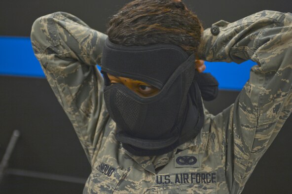 Airman 1st Class Ouma Lehnoud, 56th SFS, dons protective gear July 24 prior to participating in active-shooter scenario training at the Phoenix Police Academy shoot house. (U.S. Air Force photo/Senior Airman David Owsianka)