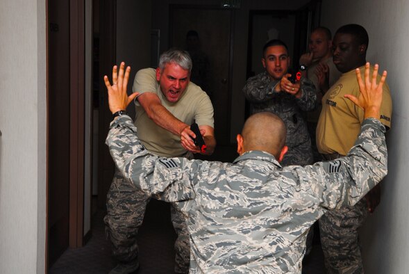 56th Security Forces Squadron personnel take down the “suspect” during a simulated active-shooter exercise June 28 at the Luke Air Force 56th SFS training facility. (U.S. Air Force photo/Senior Airman David Owsianka)
