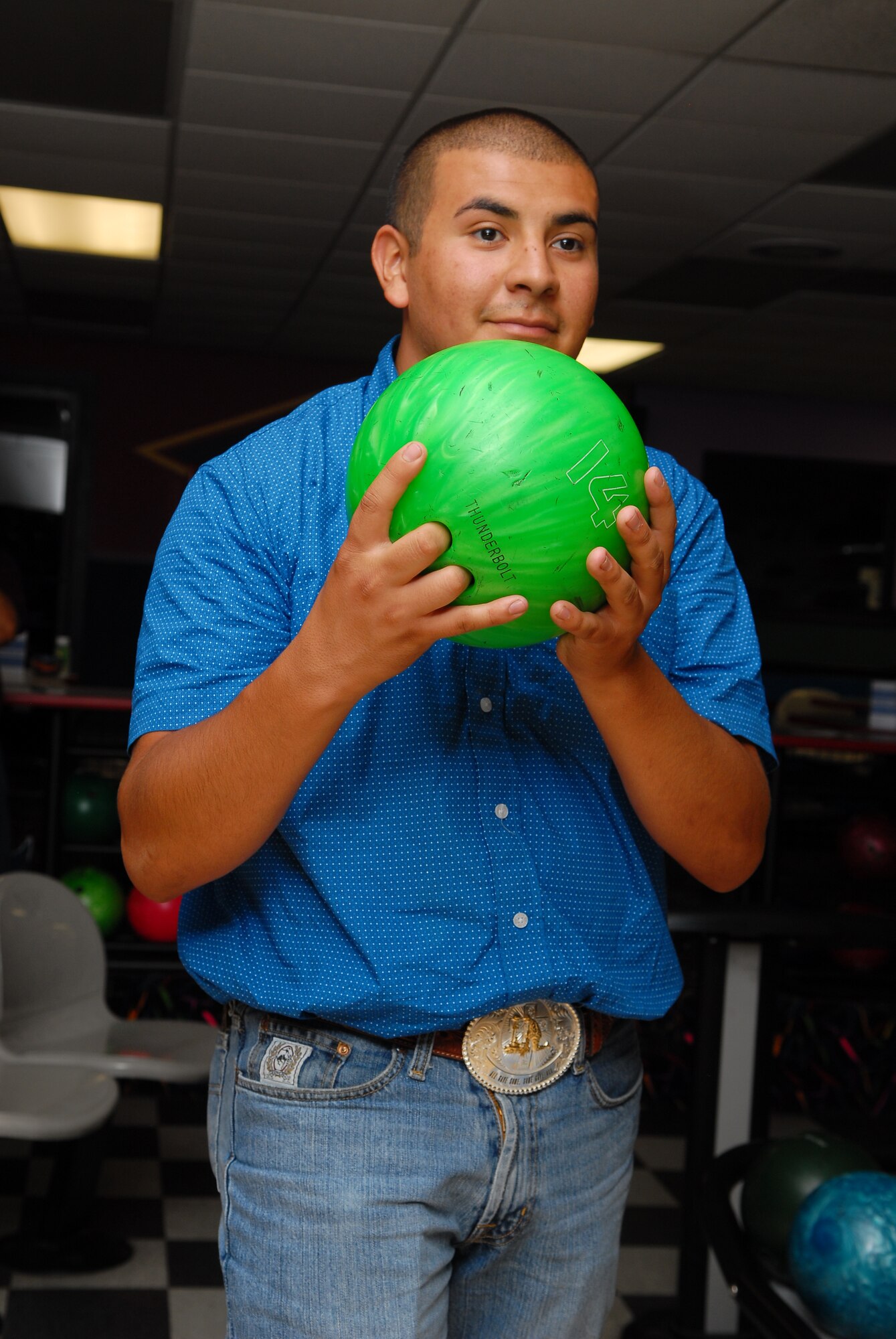 Anthony Madrid, 56th Logistics Readiness Squadron, lines up before bowling July 20 during the hook-up-to-bowling event at the Luke Air Force Base bowling center. Madrid bowled a strike during the frame.  (U.S. Air Force photo/Senior Airman David Owsianka)
