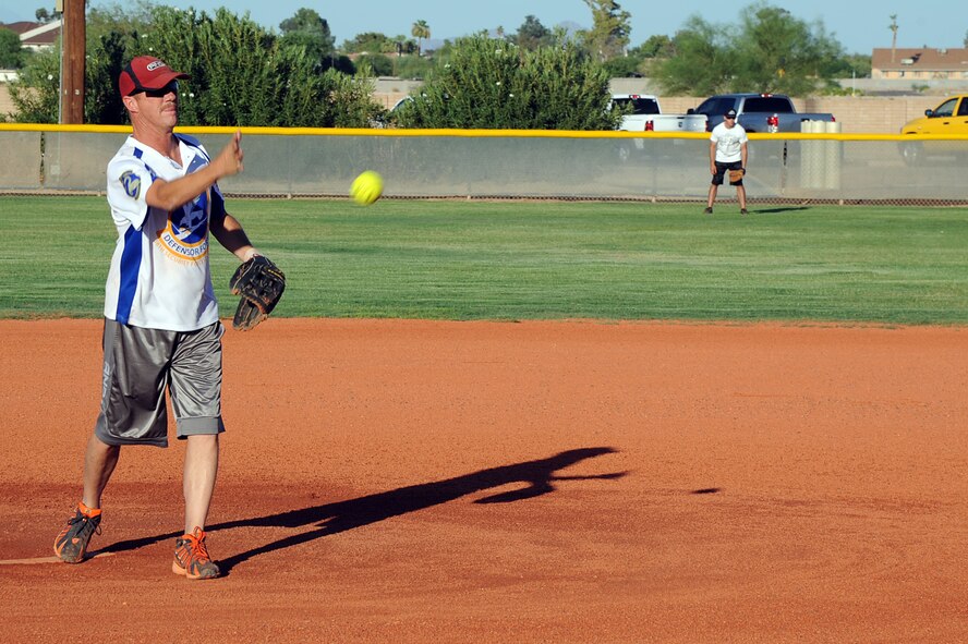 Randy Felciano, 56th Security Forces Squadron, throws a pitch during the softball championship game July 29 against the 56th Maintenance Operations Squadron at Luke Air Force Base. SFS defeated MOS 21-8 in the third game, which determined the championship. (U.S. Air Force photo/Airman 1st Class Devante Williams)