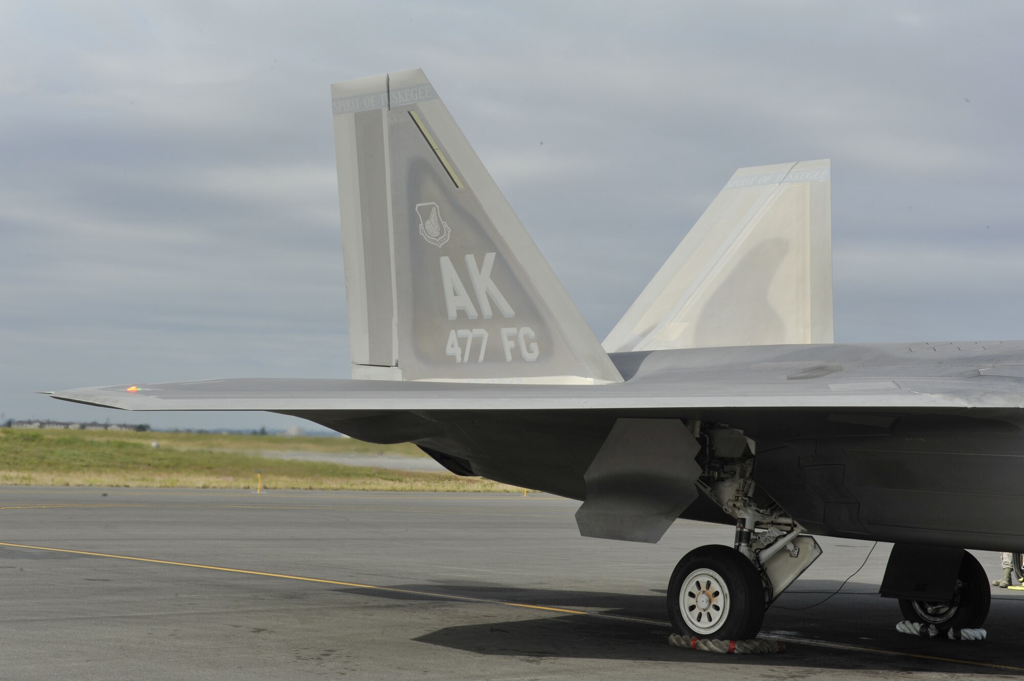 An F-22 here took flight for the first time July 31 after being transformed into the 477th Fighter Group flagship with the words “Spirit of Tuskegee” painted across the tail, a nod to the units Tuskegee Airmen heritage.  The Reserve 477th Fighter Group was previously the 477th Bombardment Group, a Tuskegee unit activated in 1944. The group's 302nd Fighter Squadron historically was part of the 332nd Fighter Group, also known as "The Redtails" the famous all-black unit that fought both American prejudice and Nazi militarism.  (U.S. Air Force/ Airman 1st Class Tammie Ramsouer)
