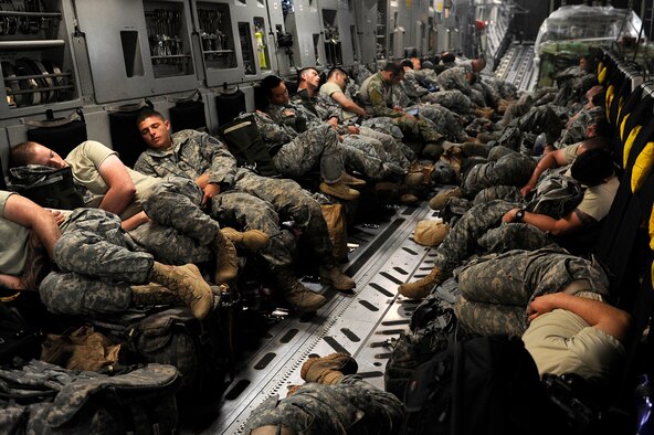 U.S. Army soldiers from the 4th Brigade (Airborne), 25th Infantry Division rest on a C-17 Globemaster III from Joint Base Lewis-McChord, Wash., over the Pacific Ocean, July 20, 2013. Airmen from McChord joined more than 28,000 Airmen, Soldiers, Sailors and Australian counterparts, as part of Talisman Saber 2013, an exercise that trained forces from both nations to operate as a combined joint task force. (U.S. Air Force photo/Staff Sgt. Zachary Wolf)
