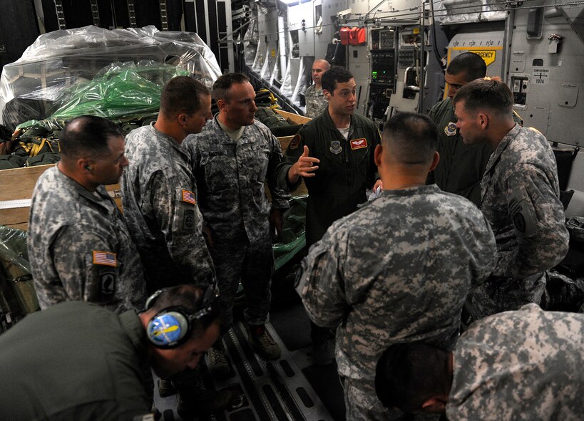 U.S. Air Force Capt. Dan Edelstein, a C-17 pilot from Joint Base Lewis-McChord, briefs jump masters from the 4th Brigade (Airborne), 25th Infantry Division, July 20, 2013. Five C-17s left Joint Base Elmendorf-Richardson, Alaska., to drop more than 400 soldiers in a 14-hour flight to Australia in support of Talisman Saber 2013. (U.S. Air Force photo/Staff Sgt. Zachary Wolf)
