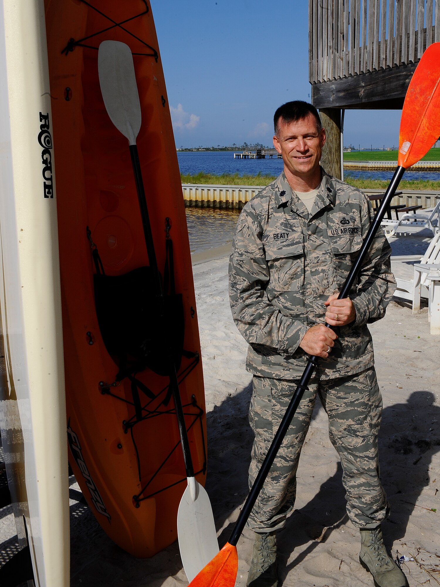U.S. Air Force Lt. Col. James Beaty, 1st Special Operations Force Support Squadron Commander stands next to a kayak on the Soundside beach on Hurlburt Field, Fla . (U.S. Air Force Photo/Airman 1st Class Jeffrey Parkinson)