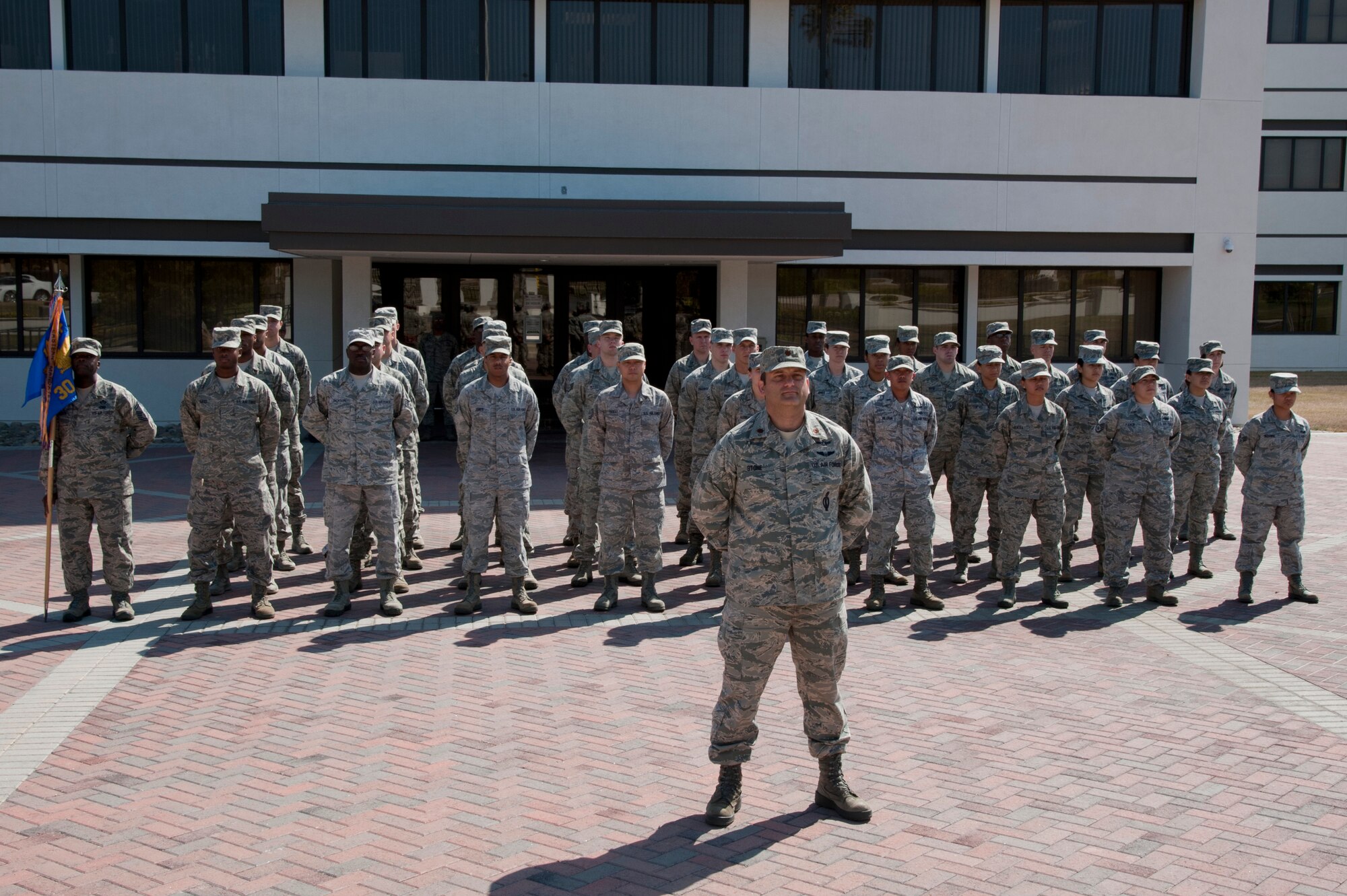VANDENBERG AIR FORCE BASE, Calif. – A 30th Space Wing wing staff agencies flight formation stands at parade rest during a retreat ceremony at the headquarters flagpole here Wednesday, July 31, 2013. The retreat ceremony became prominent after the Revolutionary War when the American Army would sound “retreat” at sunset every night. The call now announces the end of the duty day when the U.S. flag is lowered and retired for the evening. (U.S. Air Force photo/Senior Airman Lael Huss)