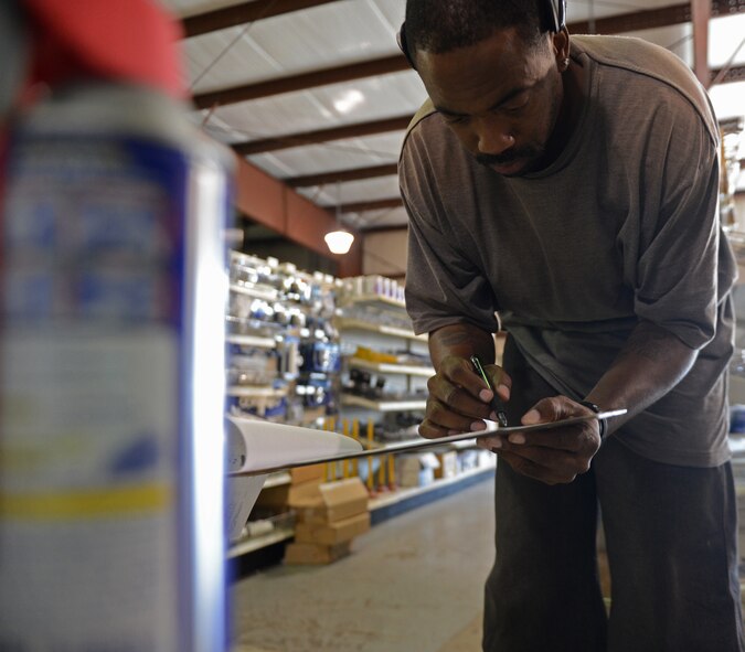 Reggie Mosley, Cosess Facility warehouse manager, takes inventory of supplies at the Cosess Facility on Barksdale Air Force Base, La., July 30, 2013. Contractors and 2nd Civil Engineer personnel can order special items from Cosess even if the facility does not carry them.  (U.S. Air Force photo/Senior Airman Micaiah Anthony)