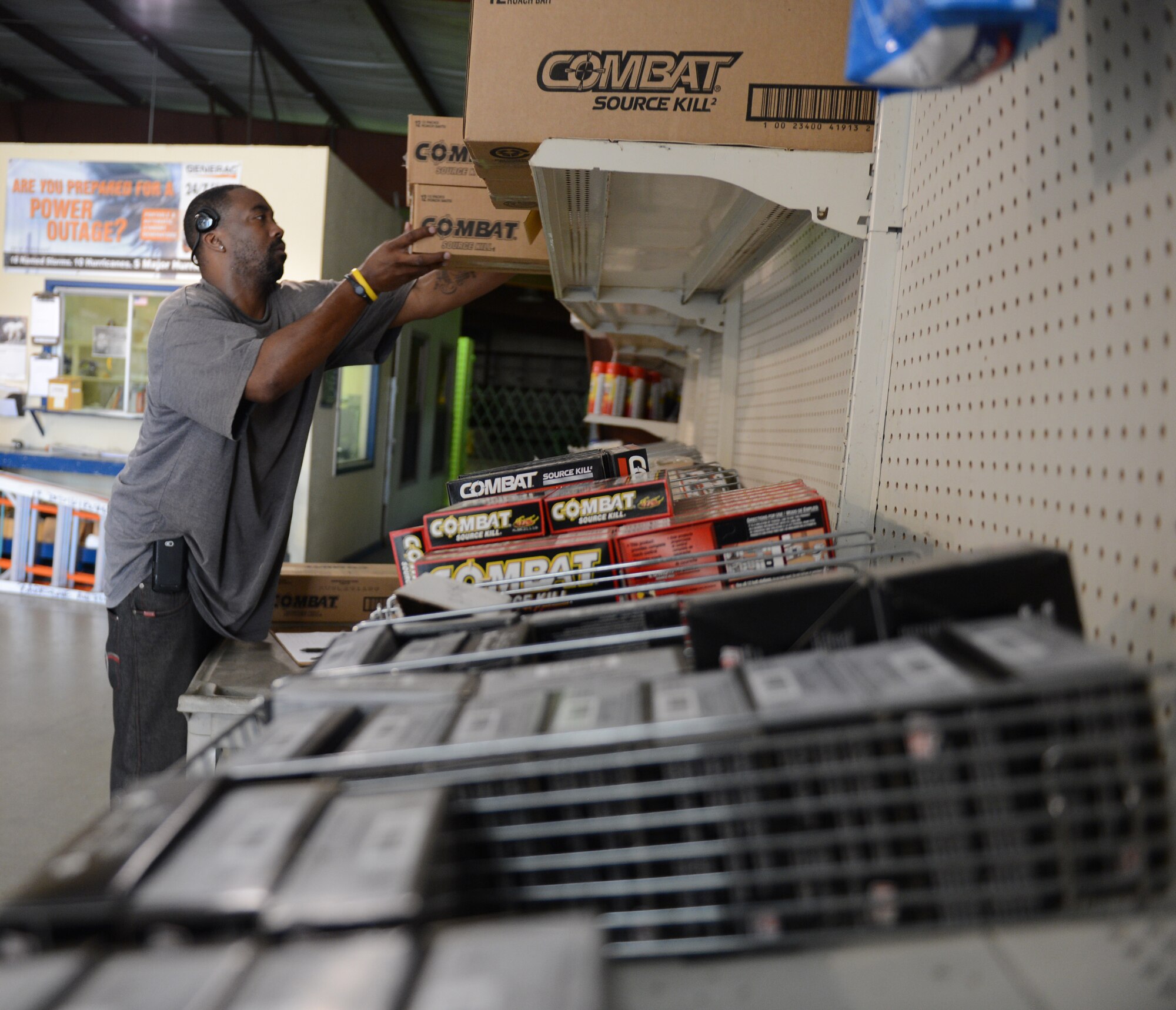 Reggie Mosley, Cosess Facility warehouse manager, stocks shelves on Barksdale Air Force Base, La., July 30, 2013. The Cosess facility provides items like bug spray and paint brushes for Barksdale facility managers to maintain their buildings. (U.S. Air Force photo/Senior Airman Micaiah Anthony)
